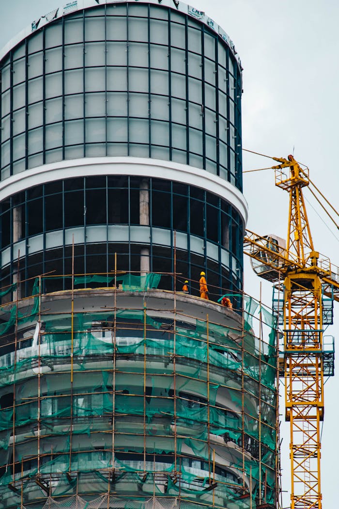 Skyscraper construction with crane in Nairobi, highlighting modern architecture and urban development.